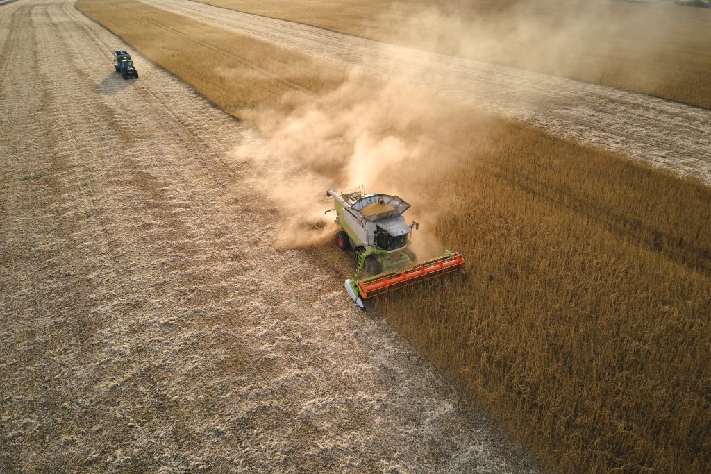 Aerial view of combine harvester Aerial view during harvesting season